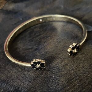 Kate Spade Gold Bracelet with Black Floral Design